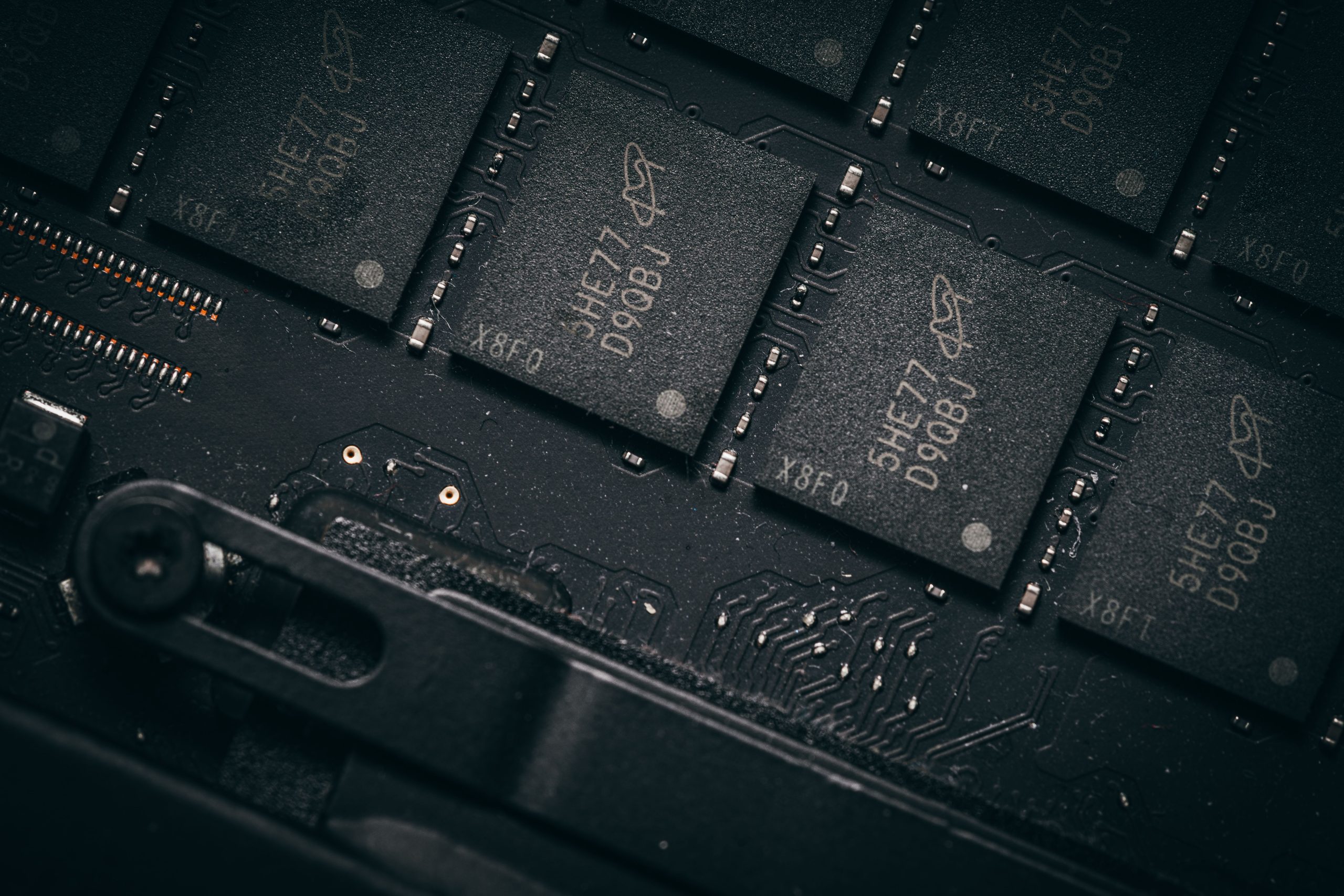 Detailed shot of microchips on a circuit board, showcasing electronic technology and precision engineering